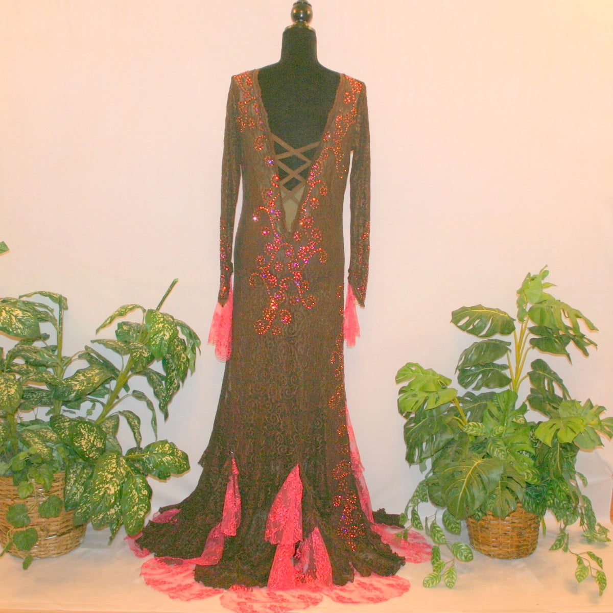 back view of Brown lace tango dress, paso dress, fabulous bolero dress or rumba dress created in luxurious chocolate brown stretch lace with accent flounces of a deep pink glitter lace, embellished with Swarovski rhinestone detail work in Indian pink, mocha, & fuchsia.