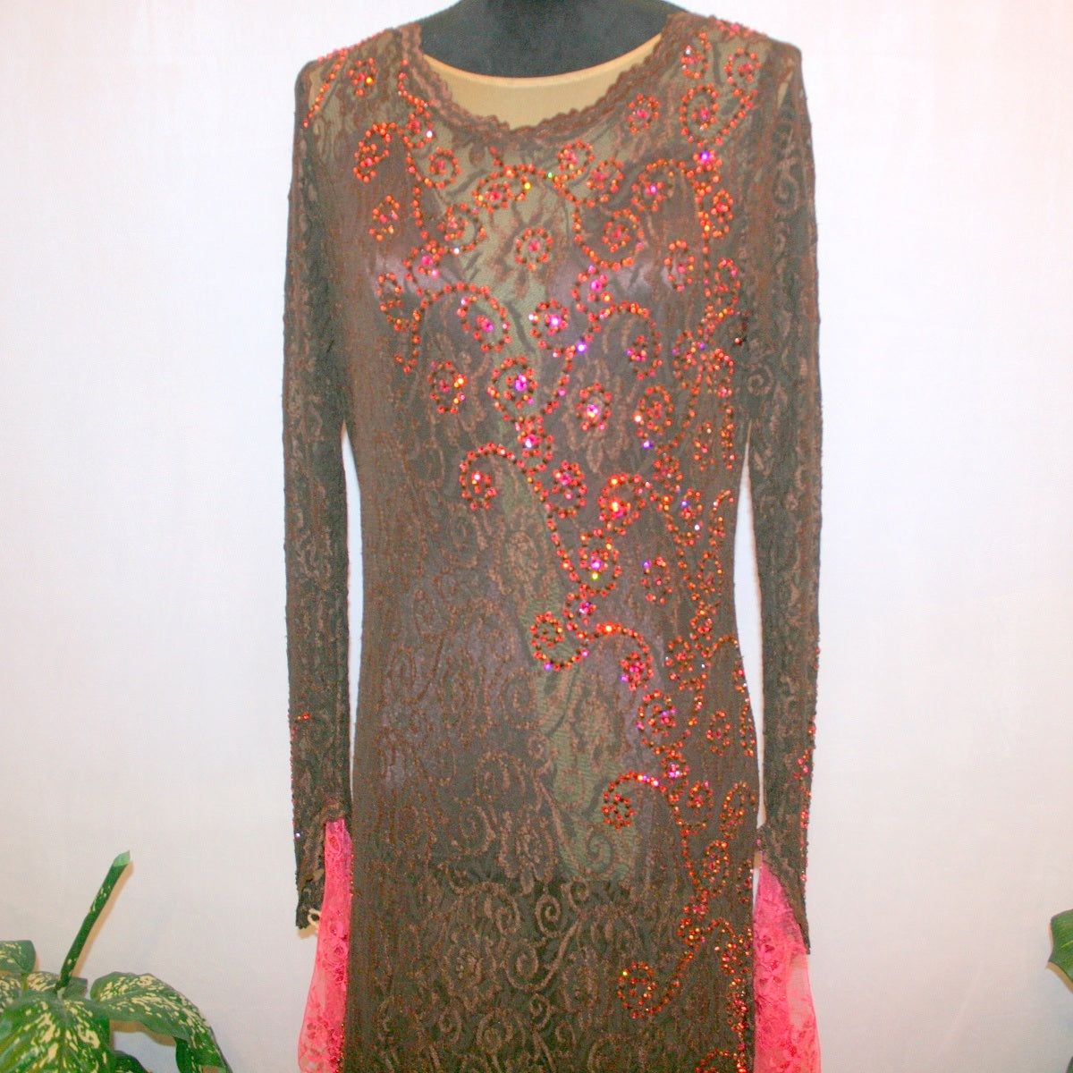 top view of Brown lace tango dress, paso dress, fabulous bolero dress or rumba dress created in luxurious chocolate brown stretch lace with accent flounces of a deep pink glitter lace, embellished with Swarovski rhinestone detail work in Indian pink, mocha, & fuchsia.